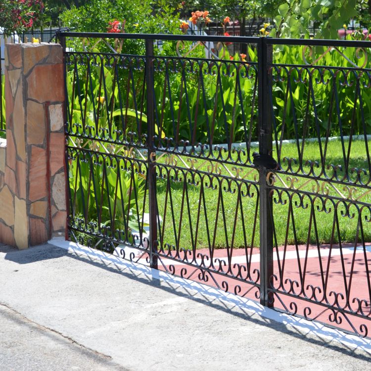 Ornate, wrought iron automatic gate installed on Forest Grove OR property by All About Garage Doors