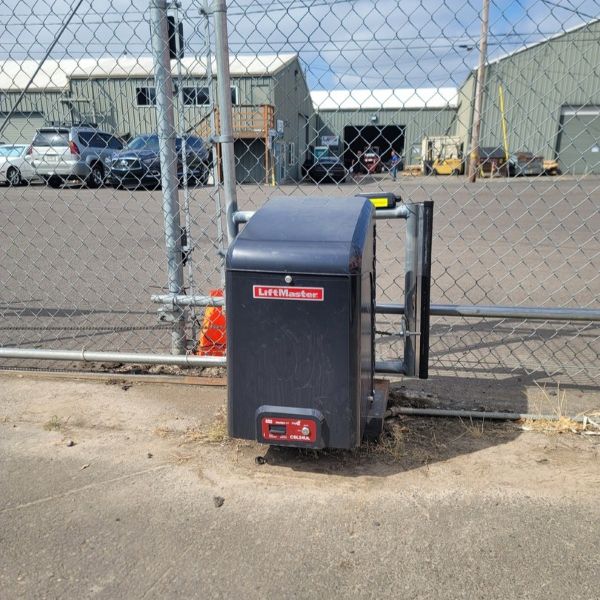 Automatic gate mechanism after installation service completed by All About Garage Doors in Oregon City OR