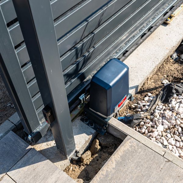 Gate opening mechanism getting tested after an automatic gate installation completed by All About Garage Doors in Portland OR