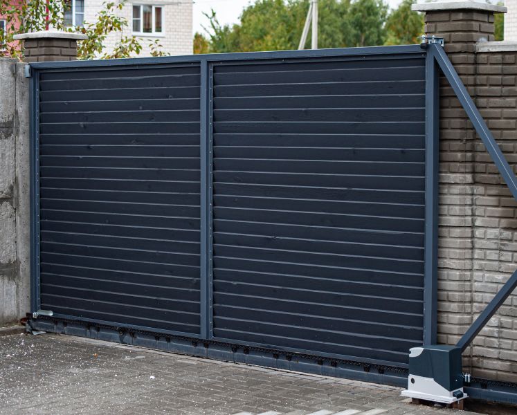 Black metal automatic gate installation finished by All About Garage Doors in Tualatin OR