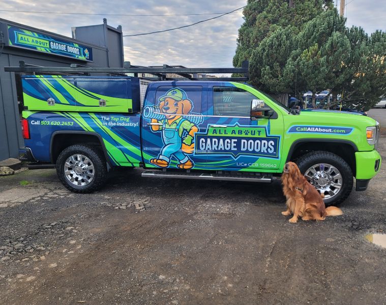 Cute golden retriever dog sitting next to All About Garage Doors service vehicle before heading out to an emergency garage door service in West Linn OR