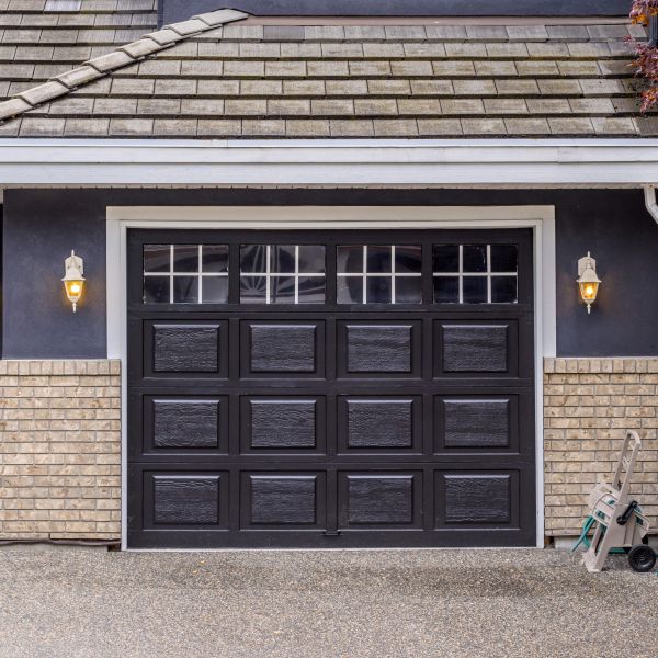 New, sleek garage door with windows after a garage door installation is completed by All About Garage Doors in Lake Oswego OR