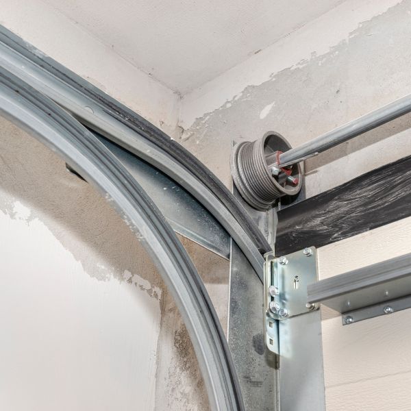 Parts being inspected by All About Garage Doors in Forest Grove OR during garage door maintenance
