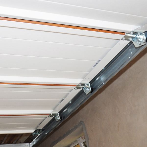 Garage door panels being inspected during garage door maintenance by All About Garage Doors in Hillsboro OR