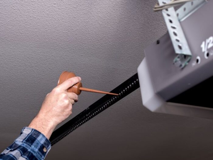 Lubricating moving parts during garage door maintenance by All About Garage Doors in Aloha OR