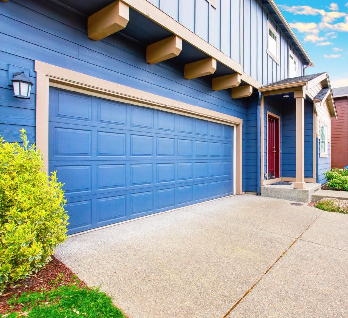 Vibrant blue home and garage after garage door maintenance in Newberg OR by All About Garage Doors