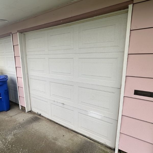 Light pink home gets garage door maintenance done by All About Garage Doors in Oregon City OR