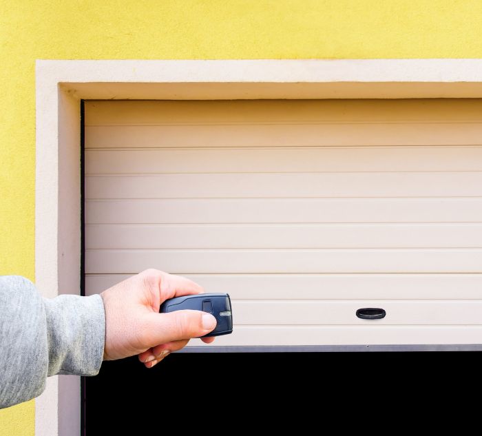 Repairing a garage door opener in Beaverton OR during garage door repair services by All About Garage Doors