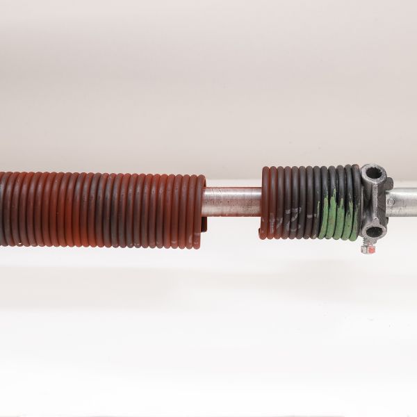 Broken spring before garage door repair services by All About Garage Doors in Aloha OR