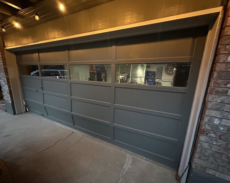 Door panels broken before getting a garage door repair done by All About Garage Doors in Tigard OR