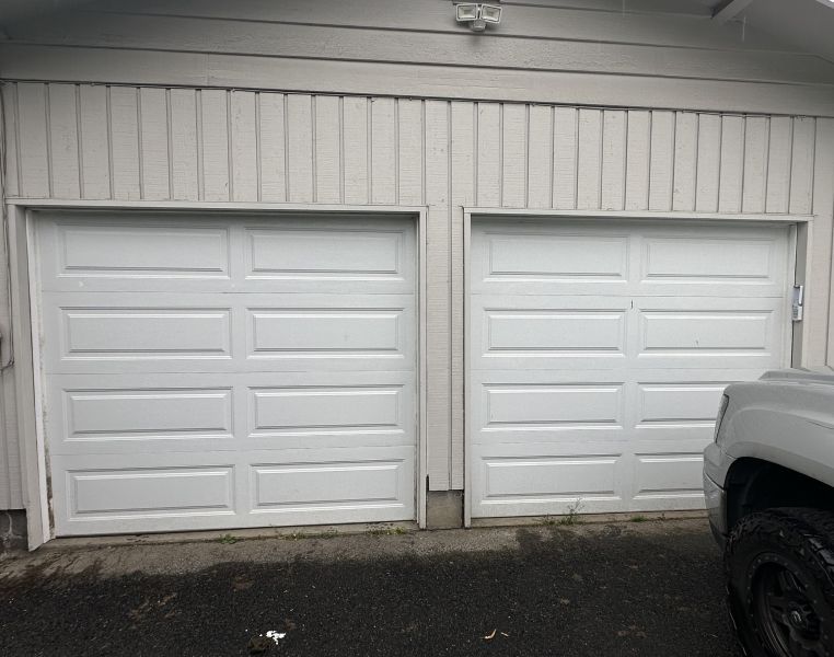 Two car garage gets a garage door repair in Tualatin OR by All About Garage Doors