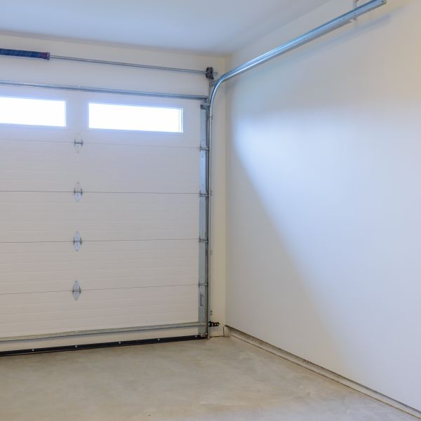 An inspection of moving parts during garage door services by All About Garage Doors in Hillsboro OR