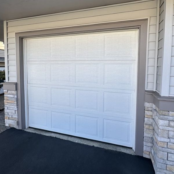 Brand new garage door installed by All About Garage Doors as part of their garage door services in Tigard OR
