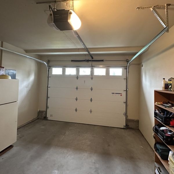 Single car garage gets a garage spring replacement by All About Garage Doors in Portland OR