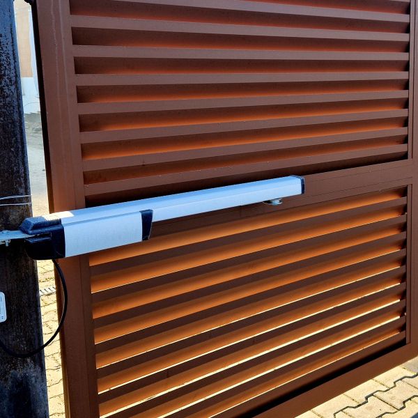 Brown metal automatic gate installation completed by All About Garage Doors in Wilsonville OR
