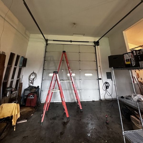 Tall commercial garage door received an emergency garage door repair from All About Garage Doors in Hillsdale Portland OR