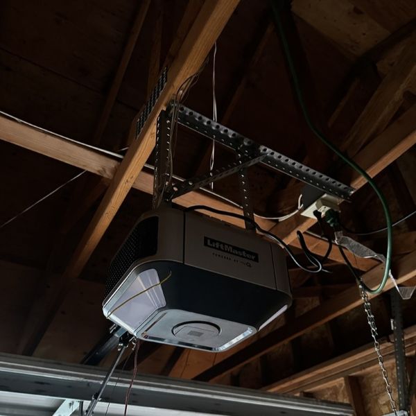 Garage door motor getting fixed during an emergency garage door repair by All About Garage Doors in Multnomah Village Portland OR