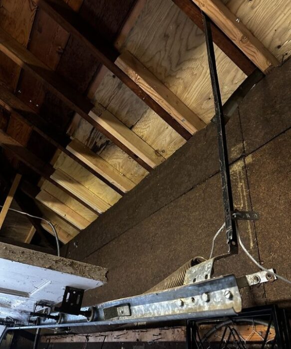 Parts of a garage door system before getting replaced during an emergency garage door repair by All About Garage Doors in Hillsdale Portland OR