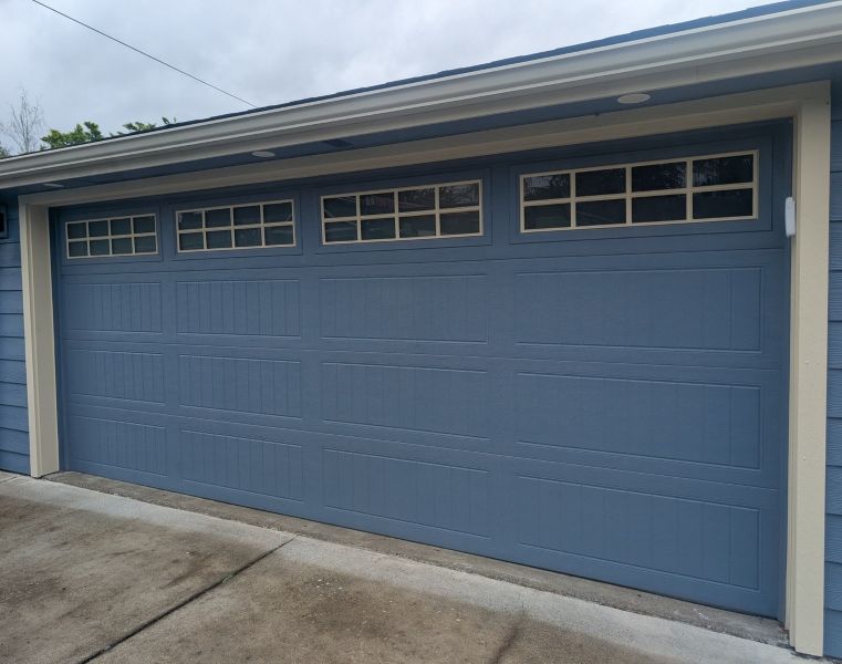 Blue garage door installation finished by All About Garage Doors in Wilsonville OR
