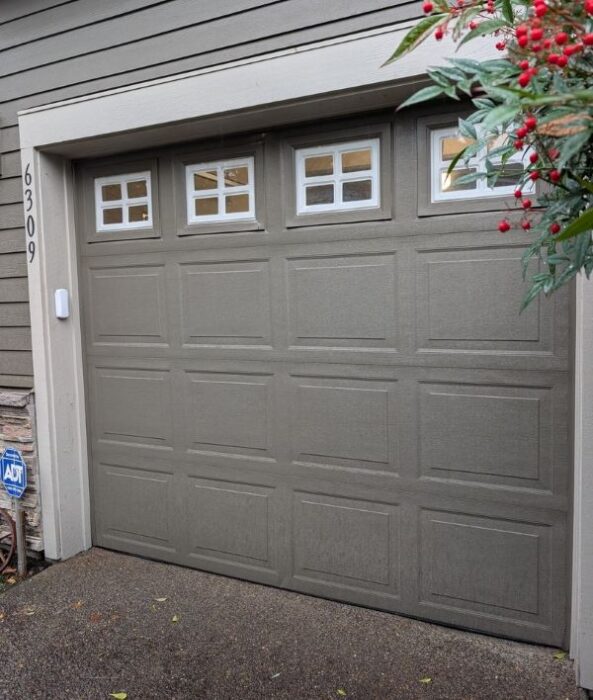 Grey/brown home gets a garage door repair by All About Garage Doors in Hillsdale Portland OR