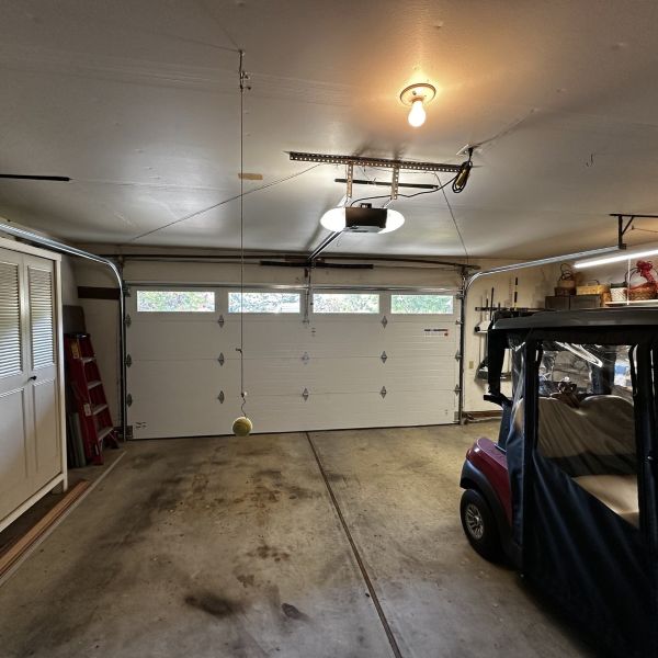 Inside of a garage after a garage spring replacement completed by All About Garage Doors in Bridlemile Portland OR