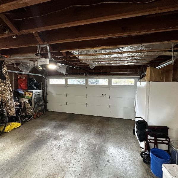 Window garage door received a garage spring replacement from All About Garage Doors in Raleigh Hills OR