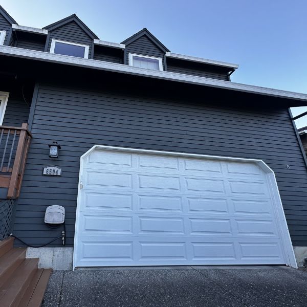 Dark grey home in Hillsdale Portland OR receives garage door maintenance from All About Garage Doors