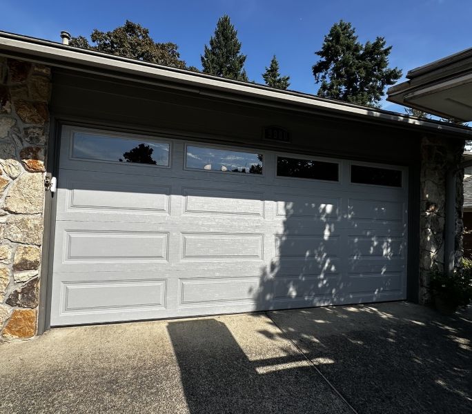 Stone exterior home in Garden Home OR uses All About Garage Doors as their local garage door experts