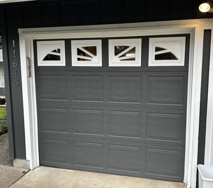 Dark grey home with white accents hires All About Garage Doors in Multnomah Village Portland OR